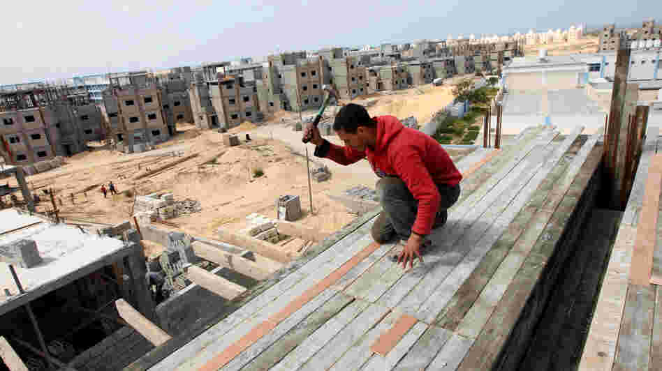 A Palestinian laborer works at the site of a residential construction project funded by the United Nations Relief and Works Agency for Palestine Refugees in Rafah, in the southern Gaza Strip, on Mar. 21, 2012.