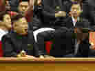 Kim Jong Un and Dennis Rodman watch North Korean and U.S. players in an exhibition basketball game at an arena in Pyongyang on Thursday.