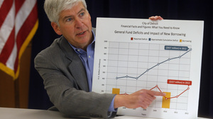 Michigan Gov. Rick Snyder in February displays a chart to illustrate the troubled state of Detroit's finances.