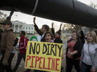 Demonstrators carry a mock pipeline as they pass the White House to protest the Keystone Pipeline, in Washington, D.C., on Nov. 18, 2012. Demonstrators carry a mock pipeline as they pass the White House to protest the Keystone Pipeline, in Washington, D.C., on Nov. 18, 2012.