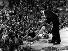 Van Cliburn accepts flowers from the audience in the Moscow Conservatory in April 1958, after a performance during the first International Tchaikovsky Competition, which he won. Van Cliburn accepts flowers from the audience in the Moscow Conservatory in April 1958, after a performance during the first International Tchaikovsky Competition, which he won.