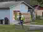 After a sinkhole swallowed a man in his bedroom in Seffner, Fla., an engineer tethered with a safety line walks in front of a home on Saturday. After a sinkhole swallowed a man in his bedroom in Seffner, Fla., an engineer tethered with a safety line walks in front of a home on Saturday.