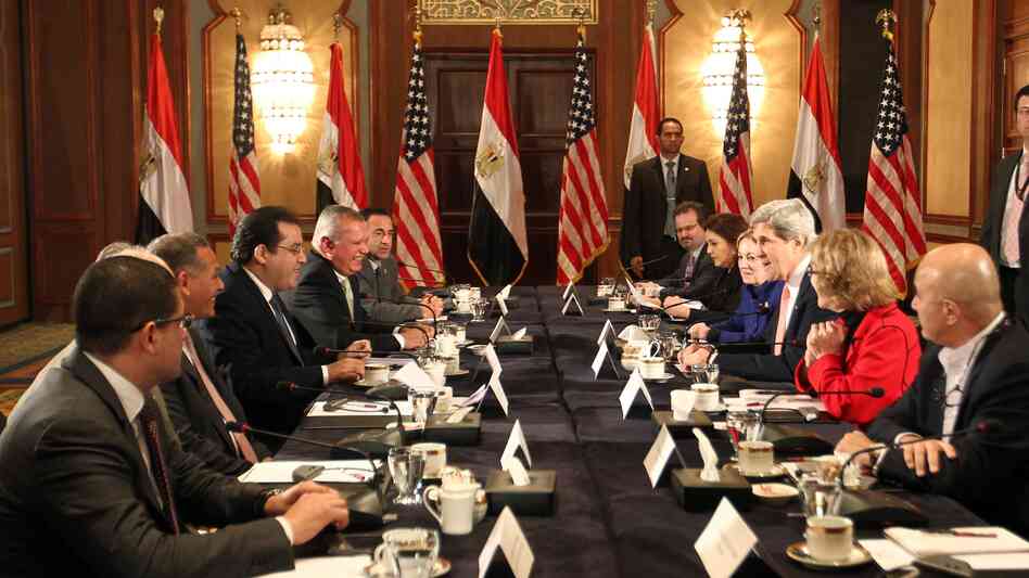 Secretary of State John Kerry (center, right) meets with members of Egyptian political parties in Cairo on Saturday.