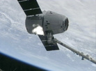 The SpaceX Dragon cargo vehicle is grappled by the International Space Station's robotic arm Sunday morning. The SpaceX Dragon cargo vehicle is grappled by the International Space Station's robotic arm Sunday morning.