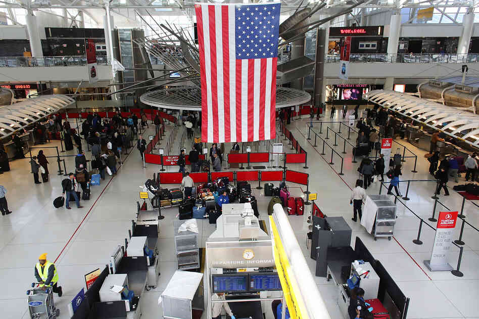 People wait in a security line at John F. Kennedy Airport on February 28, 2013 in New York City.