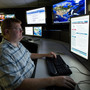 An analyst works at a federal cybersecurity center in Idaho in 2011. Experts say Internet-connected infrastructure is a possible target of cyberwarfare.