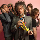 Clockwise from upper left: Flaming Lips, Sufjan Stevens, Maria Schneider, Surfer Blood. Clockwise from upper left: Flaming Lips, Sufjan Stevens, Maria Schneider, Surfer Blood.
