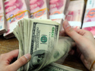 Two recent tallies of the world's richest people agree on the broad points — but not on which continent has the most billionaires. Here, U.S. dollars are counted, with Chinese yuan notes in the background. Two recent tallies of the world's richest people agree on the broad points — but not on which continent has the most billionaires. Here, U.S. dollars are counted, with Chinese yuan notes in the background.