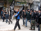 Islamists from Jabhat al Nusra stage their own protest in the town. Until recently, the group has been reluctant to appear in public. Islamists from Jabhat al Nusra stage their own protest in the town. Until recently, the group has been reluctant to appear in public.