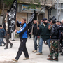 Islamists from Jabhat al Nusra stage their own protest in the town. Until recently, the group has been reluctant to appear in public.