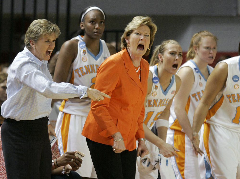 During the second half of a 2009 game that Tennessee lost to Ball State, Pat Summitt and assistant Holly Warlick react from the bench.
