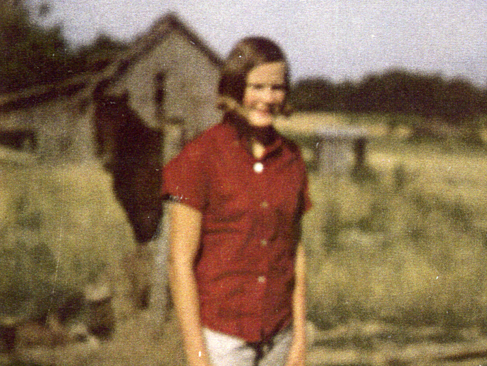 Pat Summitt, the skinny girl they called "Bone," standing in front of the hay barn where she played ball with her brothers.