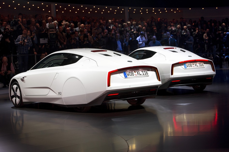 Two new Volkswagen hybrid XL1 model cars are displayed during a preview of Volkswagen ahead of the Geneva Car Show in Geneva.