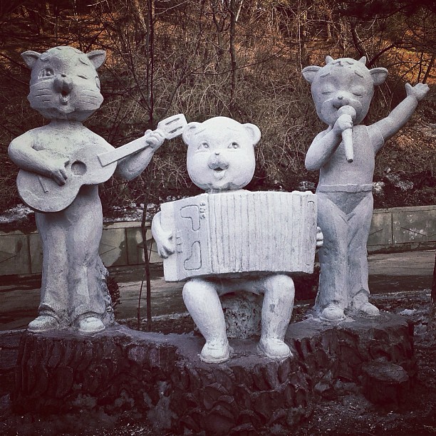 "Album cover band photo. A random statue on a roadside in #Pyongyang, North Korea."