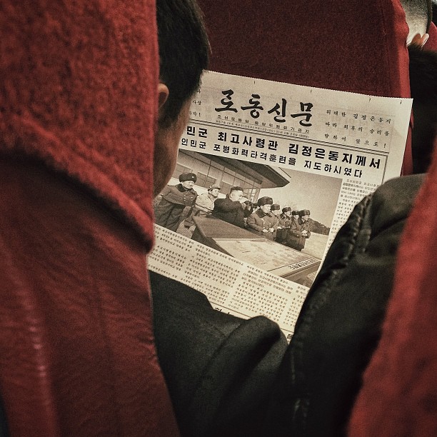 "A North Korean passenger aboard a North Korean Air Koryo flight from #Pyongyang to Beijing reads a newspaper article about leader Kim Jong Un."