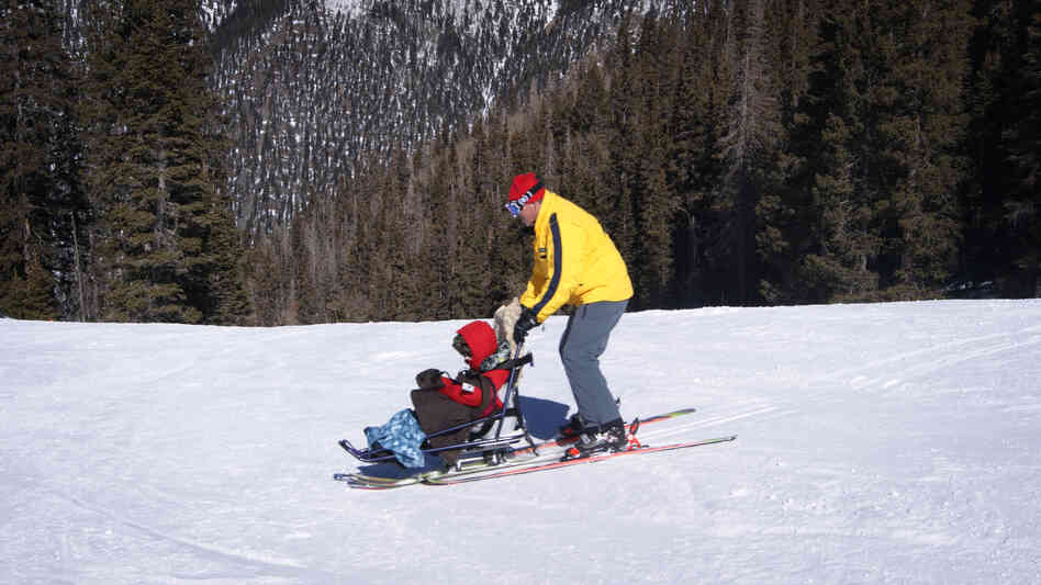 Tilghman Logan and his instructor, Craig Stagg, do some practice turns using sit skis. Some ski resorts have created opportunities for people with disabilities to participate in snow sports.