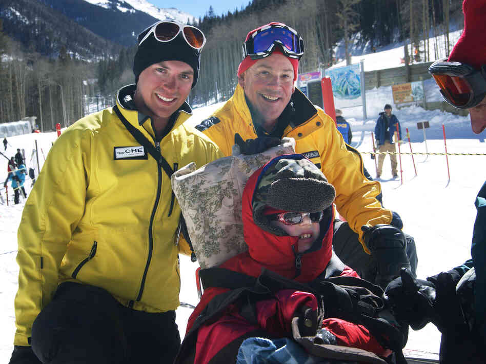 Tilghman with his instructors Ché Pirozak-Lillick (left) and Stagg after the first day of ski lessons.