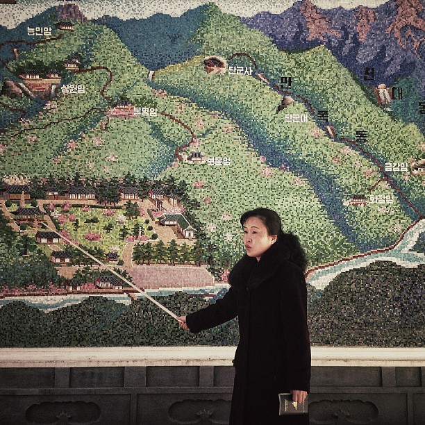 "A North Korean guide uses a pointer at the start of a tour of an historic site. ... [This] week the local service provider, Koryolink, is allowing foreigners to access the Internet on a data capable 3G connection on our mobile phones. ... [Today] I'm posting this directly from my phone while riding in the back of a van in #Pyongyang."