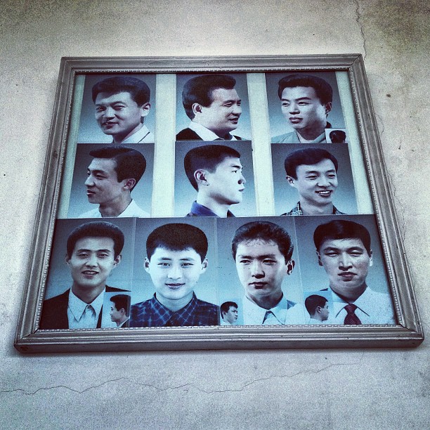 "Example haircuts on display at a barbershop in #Pyongyang."