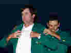 Augusta National says it has long maintained ownership of the green jackets it awards the winners of the Masters Tournament. Here, Bubba Watson accepts his jacket after winning last year's event.
