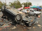 Smashed and overturned cars are shown Saturday after civil unrest in the village of Shangpu in China's southern Guangdong province. Smashed and overturned cars are shown Saturday after civil unrest in the village of Shangpu in China's southern Guangdong province.