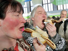 Visitors eat rostbratwurst sausages at the "Green Week" agriculture fair in Berlin in January 2011. Visitors eat rostbratwurst sausages at the "Green Week" agriculture fair in Berlin in January 2011.