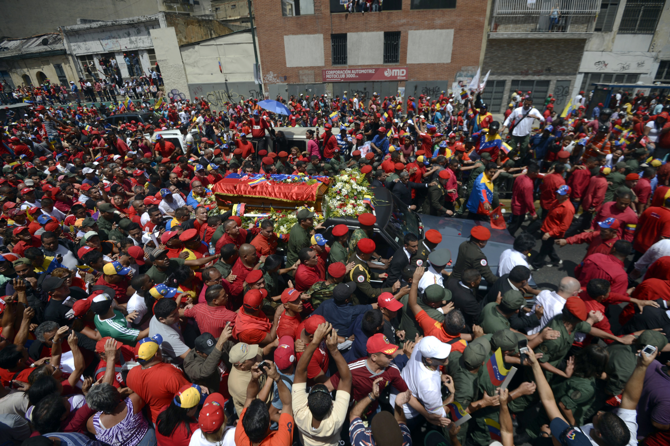 The hearse carrying the coffin of Venezuelan President Hugo Chavez makes its way to the Military Academy amid thousands of supporters, on Wednesday, in Caracas.