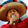Always a showman, Venezuelan President Hugo Chavez, who died Tuesday, sings folk songs with a mariachi group in the capital, Caracas, in 2005.