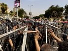 An Egyptian military police officer argues with protesters during a demonstration on June 14, 2012, outside the Supreme Constitutional Court in Cairo. An Egyptian military police officer argues with protesters during a demonstration on June 14, 2012, outside the Supreme Constitutional Court in Cairo.