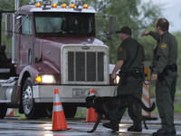 Border security agents stop a truck at a checkpoint on the way to Nogales, Ariz. More winter produce enters the U.S. at the border crossing than at any other point of entry in the country.