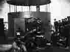 In this undated photograph provided by Naval History and Heritage Command, the crew of USS Monitor relax just outside of its turret.