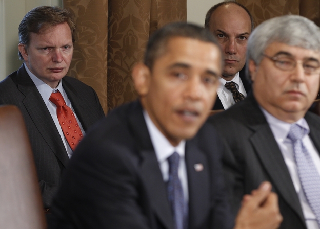 Jim Messina (left), the head of Organizing for Action and a former top Obama campaign and White House aide, watches President Obama make a statement in the White House Cabinet Room in 2010.