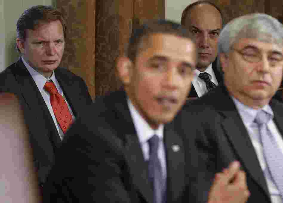 Jim Messina (left), the head of Organizing for Action and a former top Obama campaign and White House aide, watches President Obama make a statement in the White House Cabinet Room in 2010.