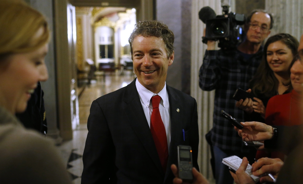 Kentucky Sen. Rand Paul leaves the floor of the Senate early Thursday following his filibuster of the nomination of John Brennan to be CIA director.