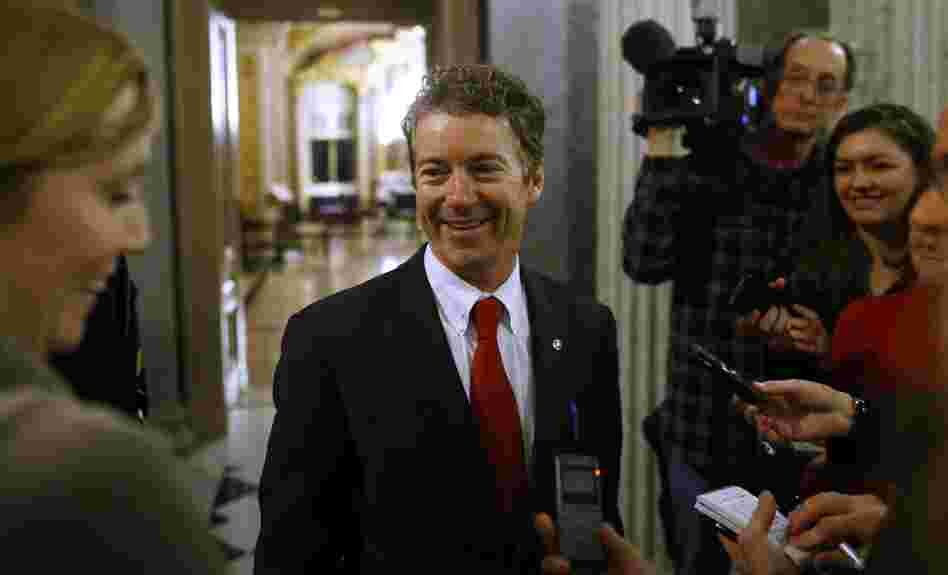 Kentucky Sen. Rand Paul leaves the floor of the Senate early Thursday following his filibuster of the nomination of John Brennan to be CIA director.