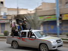 Syrian rebels celebrate in a street in the northeastern Syrian city of Raqqah after capturing the provincial capital on March 4. The government has responded with air strikes, creating a new wave of refugees. Syrian rebels celebrate in a street in the northeastern Syrian city of Raqqah after capturing the provincial capital on March 4. The government has responded with air strikes, creating a new wave of refugees.