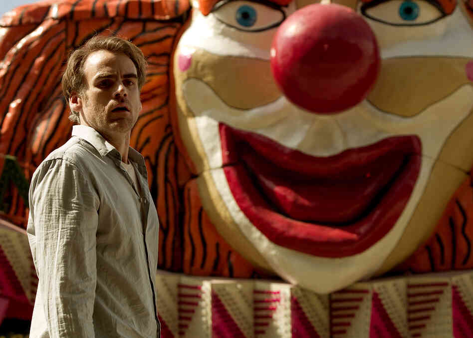 Although the bizarre amusement park motif that runs through The Silence is a bit surreal, the unsettling effect meshes neatly with the film's plot (Pictured: Sebastian Blomberg).