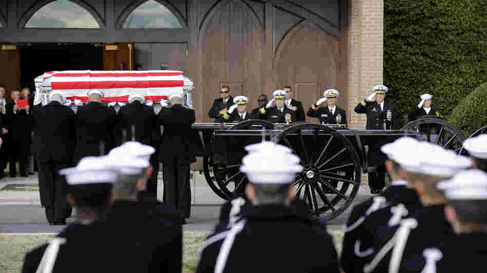 Navy honor guard teams participate in services to honor two sailors from the Civil War ship the USS Monitor on Friday in Arlington, Va.