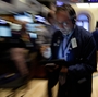 Trader Warren Meyers works on the floor of the New York Stock Exchange on Friday. Stocks opened higher after the government reported a burst of hiring last month that sent the unemployment rate to a four-year low. But both the White House and congressional Republicans reacted to the news in less than celebratory fashion.