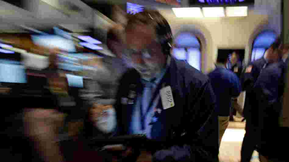 Trader Warren Meyers works on the floor of the New York Stock Exchange on Friday. Stocks opened higher after the government reported a burst of hiring last month that sent the unemployment rate to a four-year low. But both the White House and congressional Republicans reacted to the news in less than celebratory fashion.