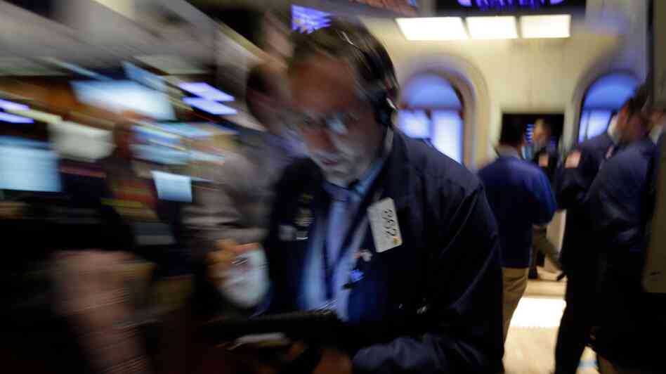 Trader Warren Meyers works on the floor of the New York Stock Exchange on Friday. Stocks opened higher after the government reported a burst of hiring last month that sent the unemployment rate to a four-year low. But both the White House and congressional Republicans reacted to the news in less than celebratory fashion.