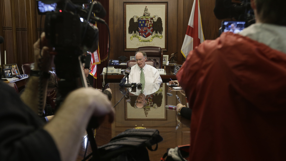Gov. Robert Bentley talks with reporters in his office, one day after Alabama Republicans adopted legislation to provide state tax credits to attend private schools.