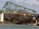 An image taken from a video depicts a section of the Dick Henderson Memorial Bridge in Nitro, WV, being demolished by a controlled explosion Friday. An image taken from a video depicts a section of the Dick Henderson Memorial Bridge in Nitro, WV, being demolished by a controlled explosion Friday.
