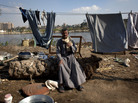 An Egyptian farmer drinks tea near his home on Qursaya island, in the Nile River, next to Cairo, in January. The Egyptian military says it is the registered owner of the island's land, a claim disputed by the farmers and fishermen who live there. An Egyptian farmer drinks tea near his home on Qursaya island, in the Nile River, next to Cairo, in January. The Egyptian military says it is the registered owner of the island's land, a claim disputed by the farmers and fishermen who live there.