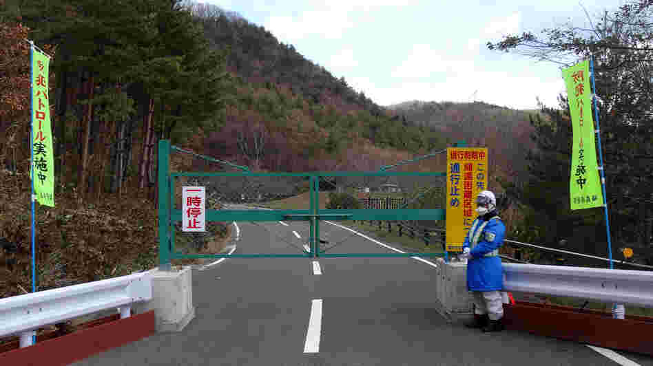 A road leading back to the Togawas' old home in the seaside village of Namie is closed due to radioactive contamination. A road leading back to the Togawas' old home in the seaside village of Namie is closed due to radioactive contamination.