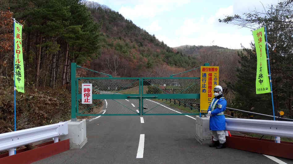 A road leading back to the Togawas' old home in the seaside village of Namie is closed due to radioactive contamination. A road leading back to the Togawas' old home in the seaside village of Namie is closed due to radioactive contamination.