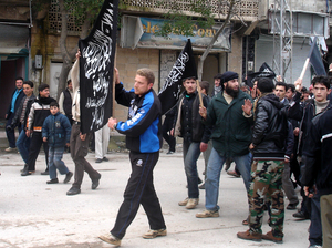 Islamists from Jabhat al-Nusra stage a protest in the Syrian town of Kfar Nabel. Until recently, the group has been reluctant to appear in public.