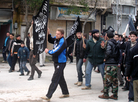 Islamists from Jabhat al-Nusra stage a protest in the Syrian town of Kfar Nabel. Until recently, the group has been reluctant to appear in public.