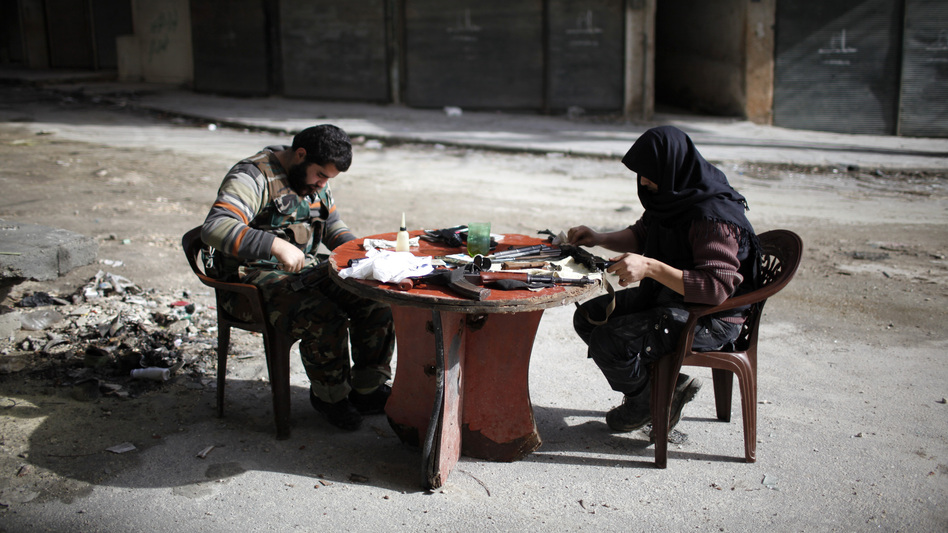 Members of Jabhat al-Nusra clean their weapons, in Aleppo in December. The Islamist rebel group has become an increasingly powerful force in Syria's civil war.