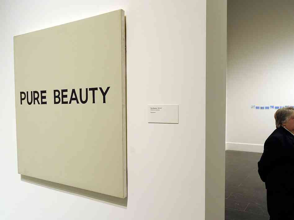 "Pure Beauty," shown here at the Metropolitan Museum of Art in New York in 2010, is one of John Baldessari's many provocative "text paintings." "Pure Beauty," shown here at the Metropolitan Museum of Art in New York in 2010, is one of John Baldessari's many provocative "text paintings."